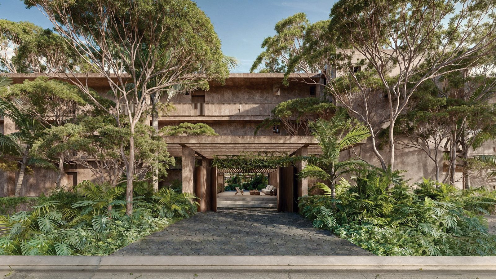 Residential entrance surrounded by gardens and tropical greenery